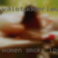 Women smoke looking